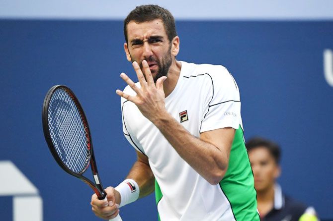 Marin Cilic reacts after losing a point 