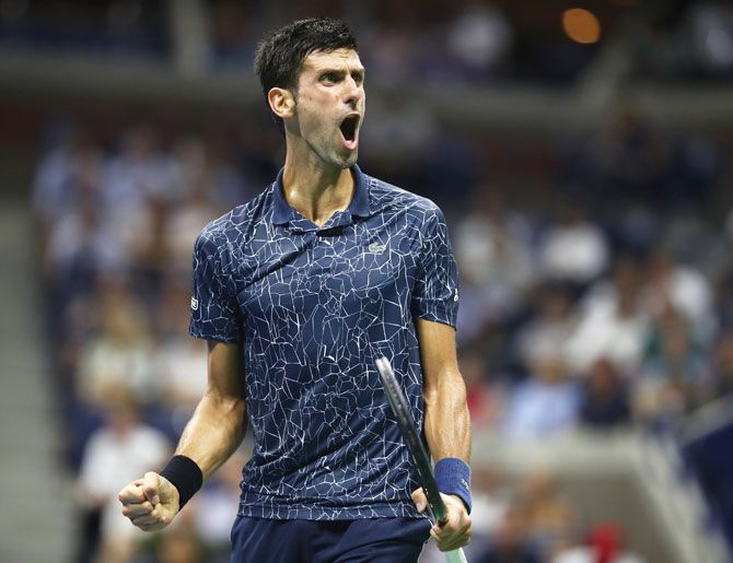 Serbia's Novak Djokovic celebrates a point during his men's singles quarter-final match against Australia's John Millman during their quarter-final at the USTA Billie Jean King National Tennis Center in the Flushing neighborhood of the Queens borough of New York City on Wednesday