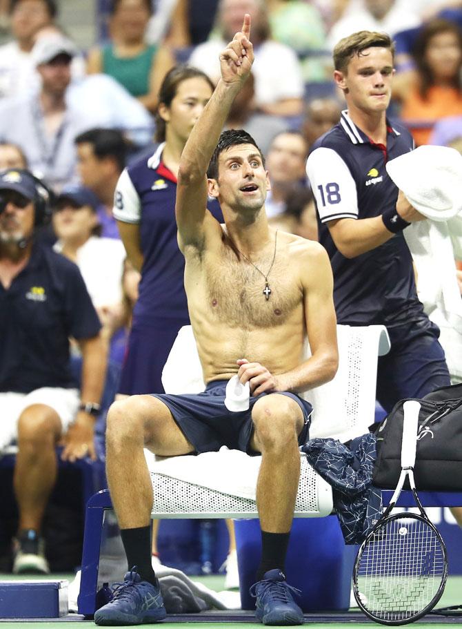 Djokovic signals to his box for something