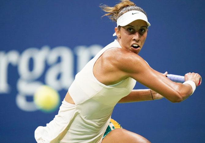 USA's Madison Keys hits return during her quarter-final against Spain's Carla Suarez Navarro