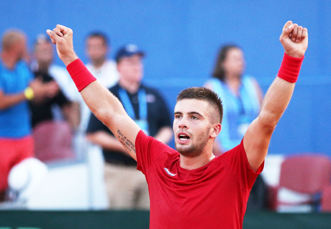 Croatia's Borna Coric celebrates winning his match against Frances Tiafoe of the USA in their Davis Cup match in Sportski centar Visnjik, in Zadar, Croatia, on Sunday