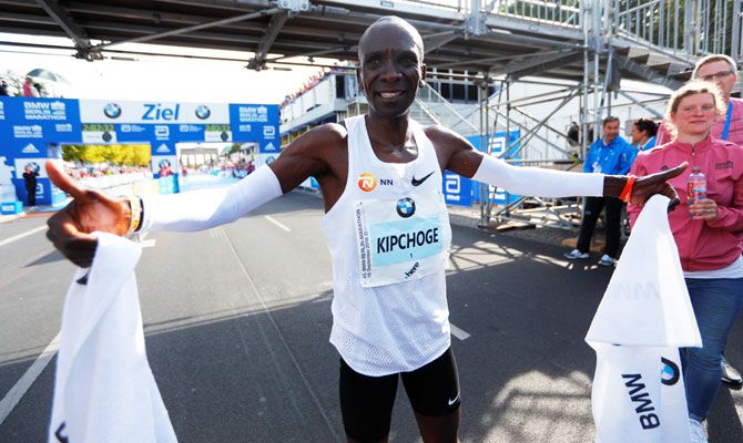 Kenya's Eliud Kipchoge celebrates winning the Berlin Marathon and breaking World Record on Sunday