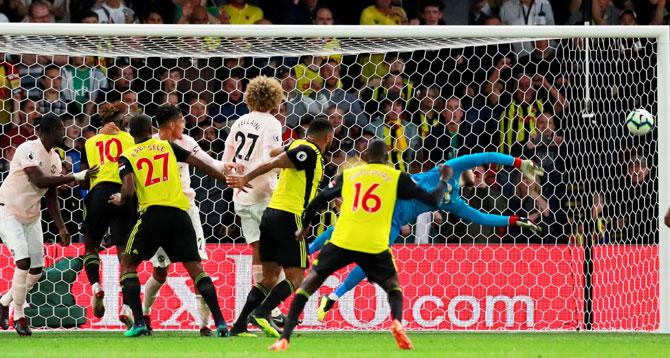 Manchester United's David de Gea makes a save during the EPL match against Watforfd at Vicarage Road in Watford on Saturday