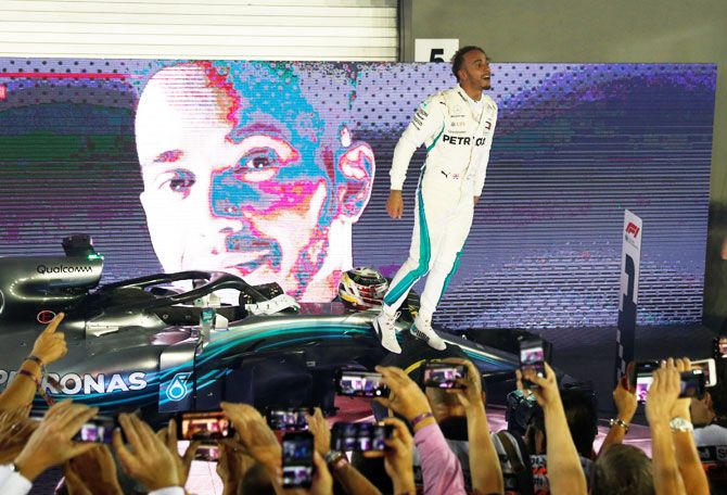 Mercedes' Lewis Hamilton celebrates after winning the Singapore F1 GP on Sunday