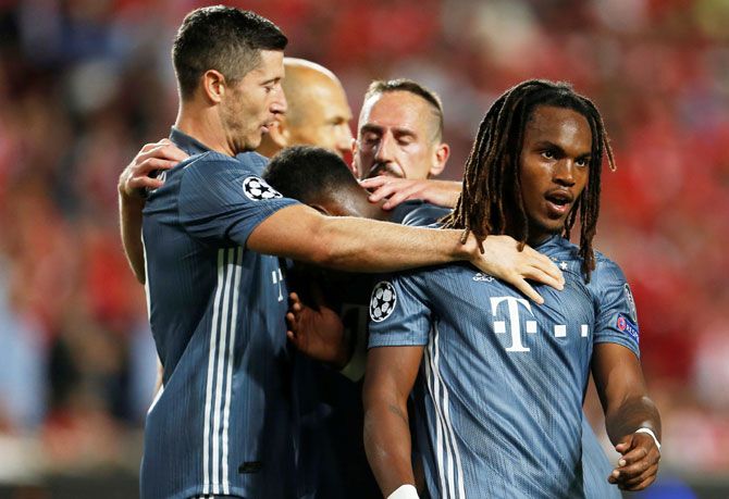 Bayern Munich's Renato Sanches (right) celebrates with Robert Lewandowski and teammates after scoring their second goal against Benfica on Wednesday
