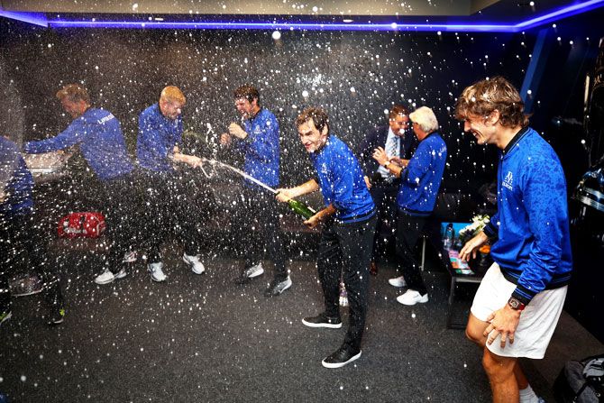 Team Europe Roger Federer's celebrates with his teammates in the locker room after winning the Laver Cup on day three at the United Center in Chicago, Illinois, on Sunday