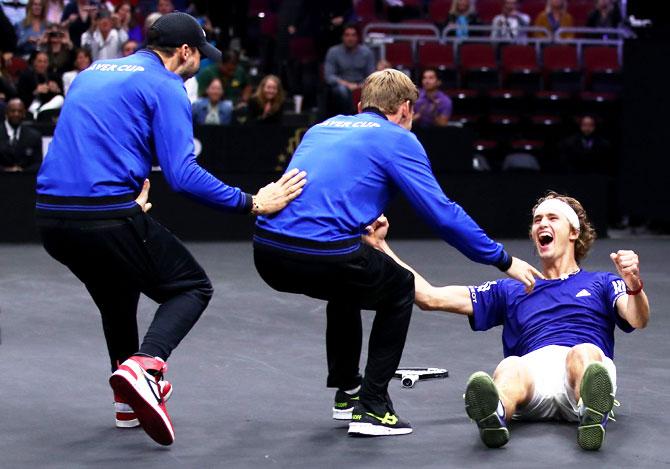 Team Europe's Alexander Zverev celebrates with teammates David Goffin and Grigor Dimitrov after defeating Team World's Kevin Anderson in their Men's Singles match on day three to win the 2018 Laver Cup