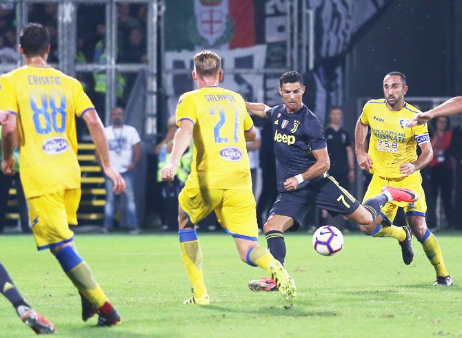 Juventus' Cristiano Ronaldo scores the opening goal against Frosinone Calcio during their serie A match at Stadio Benito Stirpe in Frosinone, Italy, on Sunday