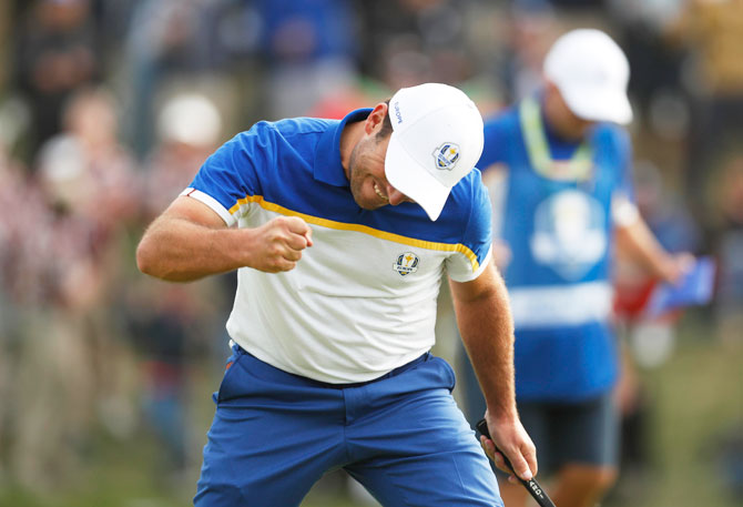 Team Europe's Francesco Molinari celebrates winning his Singles