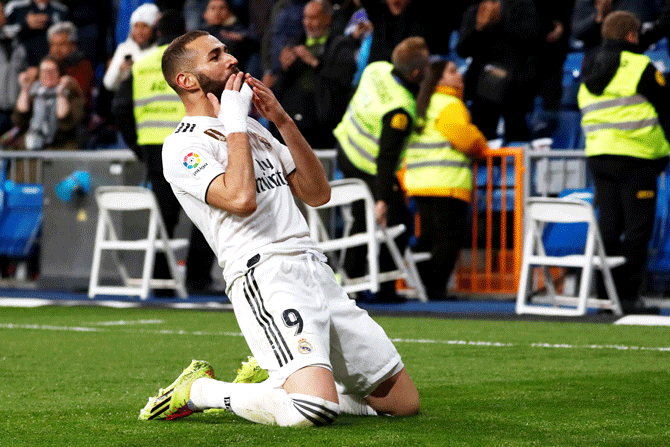 Real Madrid's Karim Benzema celebrates scoring their third goal against SD Huesca in Santiago Bernabeu in Madrid on Sunday