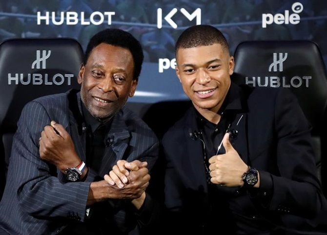Brazil soccer legend Pele and France's Kylian Mbappe pose ahead of their meeting in Paris on April 2