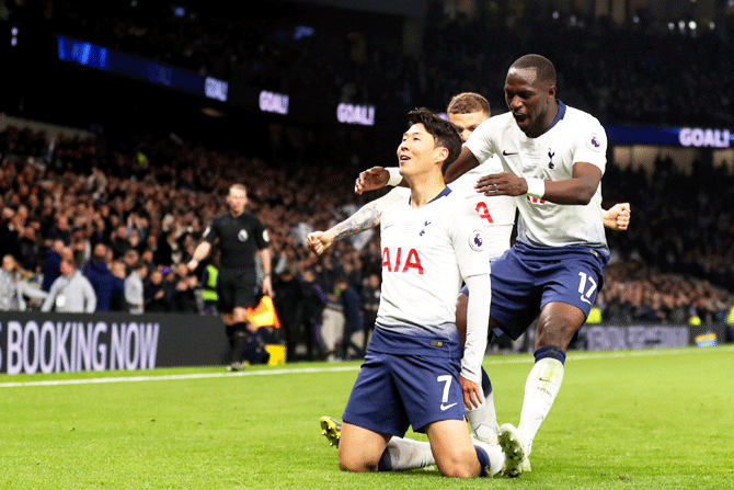 Tottenham Hotspur's Heung-Min Son celebrates with his team mates after scoring his team's first goal against Crystal Palace at Tottenham Hotspur Stadium in London