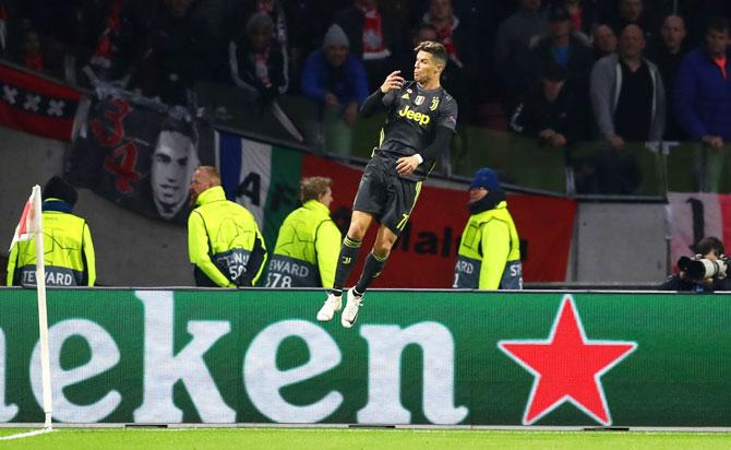 Juventus' Cristiano Ronaldo celebrates after scoring his team's first goal during their match against Ajax at Johan Cruyff Arena in Amsterdam