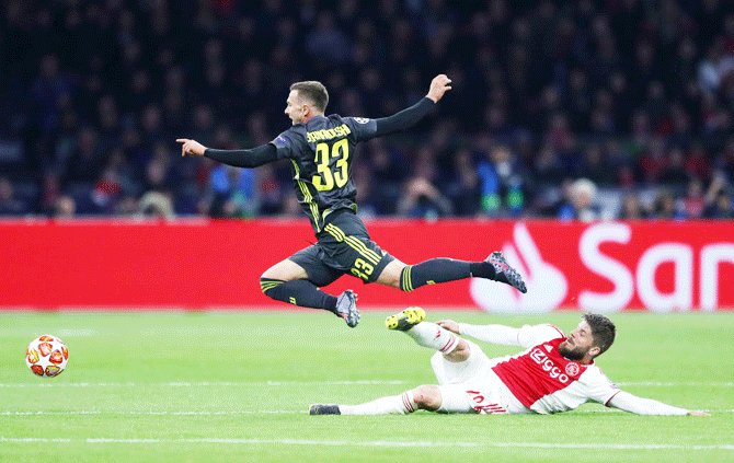 Juventus' Federico Bernardeschi is fouled by Ajax's Lasse Schone during their Champions League first leg quarter-final tie on Wednesday