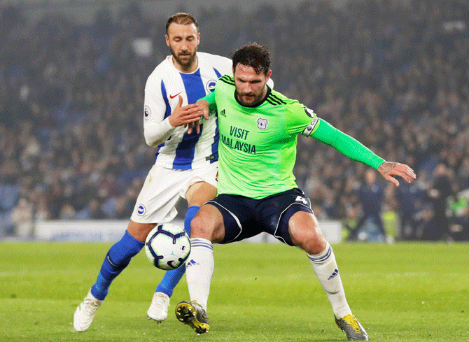 Cardiff City's Sean Morrison and Brighton's Glenn Murray vie for possession