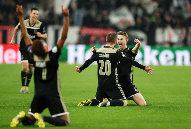 jax's Matthijs de Ligt celebrates teammate Lasse Schone after knocking out Juventus at Allianz Stadium in Turin