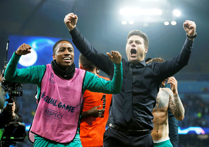 Tottenham manager Mauricio Pochettino and Tottenham's Kyle Walker-Peters celebrate after the match