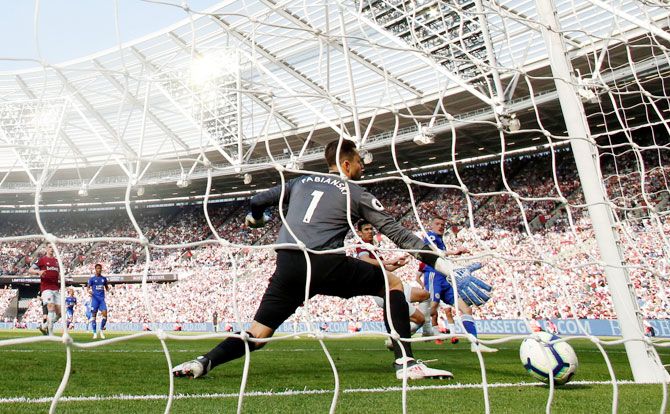 Leicester City's Jamie Vardy scores their first goal against West Ham United at London Stadium, London