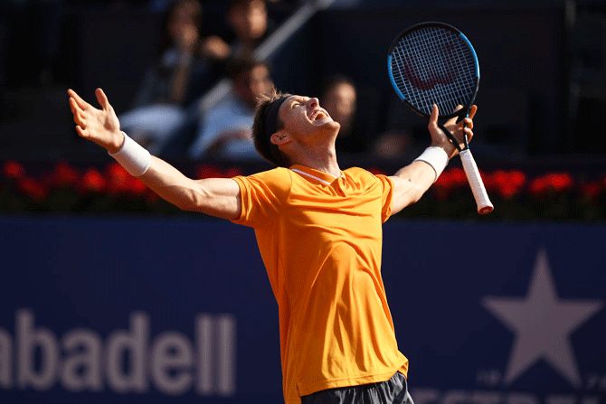 Chile's Nicolas Jarry celebrates after defeating Germany's Alexander Zverev  in their Round of 32 match on Day 2 of the Barcelona Open Banc Sabadell at Real Club De Tenis Barcelona in Barcelona, Spain, on Tuesday