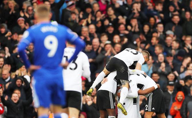 Fulham's Ryan Babel celebrates with teammates after scoring their first goal against Cardiff City at Craven Cottage, London