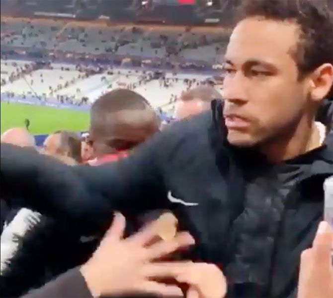 A video grab of PSG's Neymar punching a fan in the stands after losing the French Cup final against Stade Rennes on Sunday