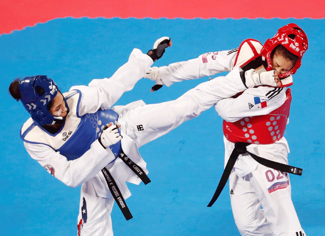 Chile's Fernanda Aguirre competes with Panama's Carolena Carstens during their taekwondo women's Under 57kg bronze medal match on July 28