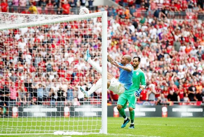 Manchester City's Kyle Walker clears the ball from the goal line in the dying moments of added time.