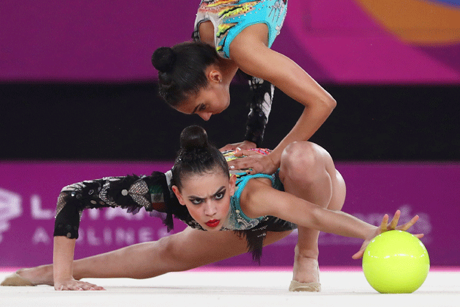 Mexican gymnasts in action during the Rhythmic Gymnastics, 5 balls final in Polideportivo Villa El Salvador on August 4