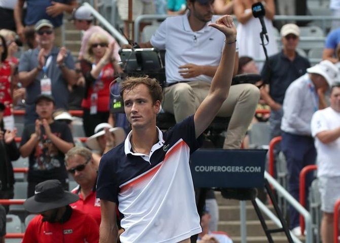 Daniil Medvedev of Russia waves to the crowd after defeating Dominic Thiem of Austria