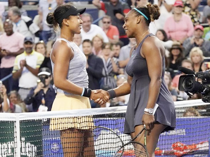  Naomi Osaka, left, congratulates Serena Williams on her victory.