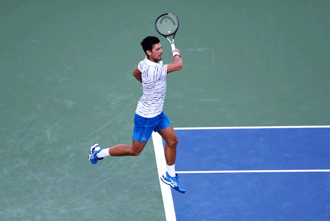 Serbia's Novak Djokovic plays a return against USA's Sam Querrey during Day 4 of the Western and Southern Open, Cincinnati Masters at Lindner Family Tennis Center in Mason, Ohio, on Tuesday