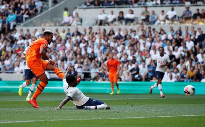 Joelinton scores for Newcastle United during their Premier League match against Tottenham Hotspur.