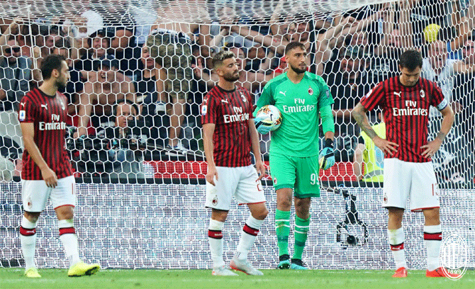 AC Milan wear a dejected look during their Serie A match against Udinese on Sunday