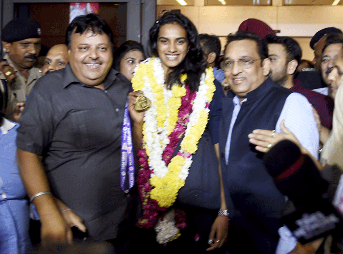 The media jostled with each other to catch as PV Sindhu arrives at IGI airport in New Delhi on Monday