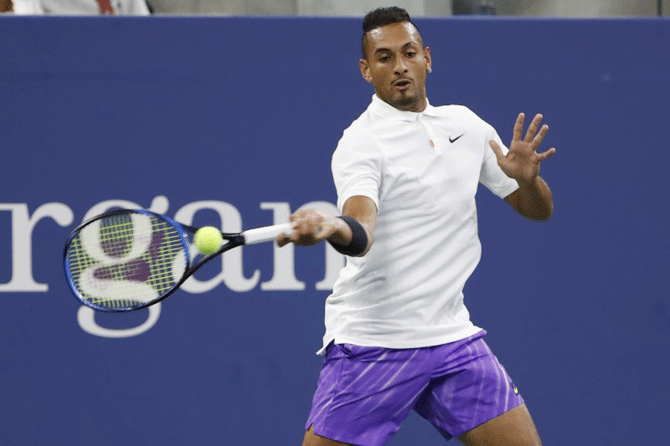 Australia's Nick Kyrgios hits a forehand against USA's Steve Johnson in their first round match on Day 2
