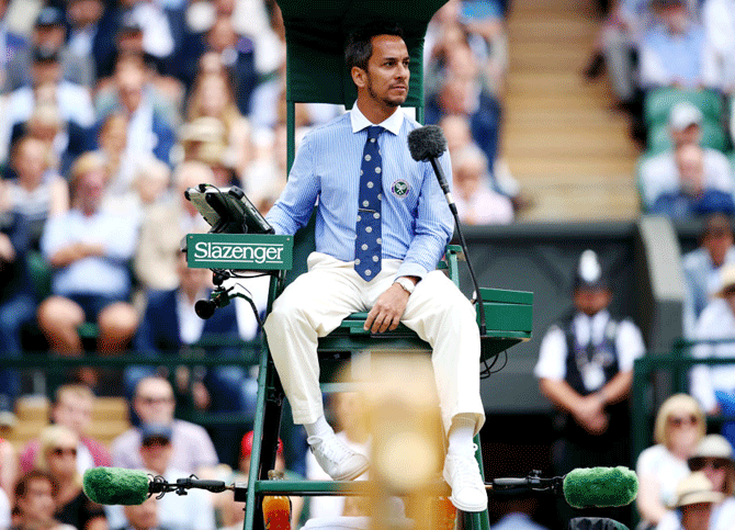 Chair Umpire Damian Steiner looks on during the Wimbledon men's singles final between Roger Federer and Novak Djokovic at the All England Lawn Tennis and Croquet Club in London, England, on July 14, 2019