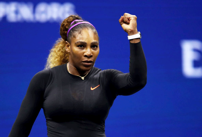 USA's Serena Williams celebrates defeating compatriot Catherine McNally in their US Open women's singles second round match at the USTA Billie Jean King National Tennis Center in Flushing Meadows of the Queens borough of New York City, New York on Wednesday