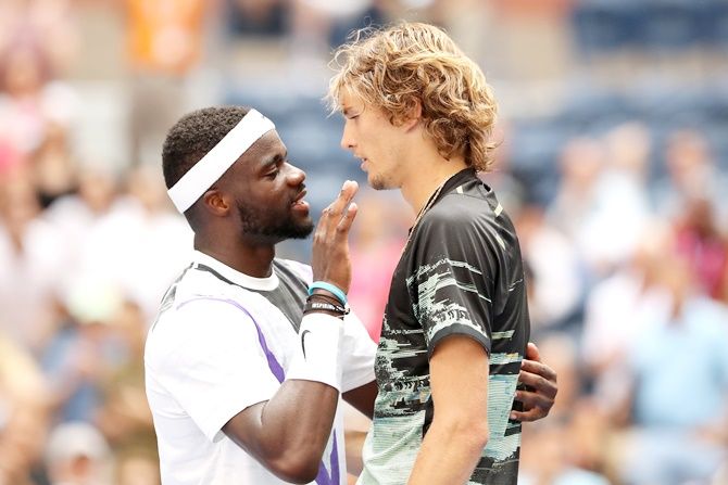 Frances Tiafoe and Alexander Zverev greet each other following their second round match.