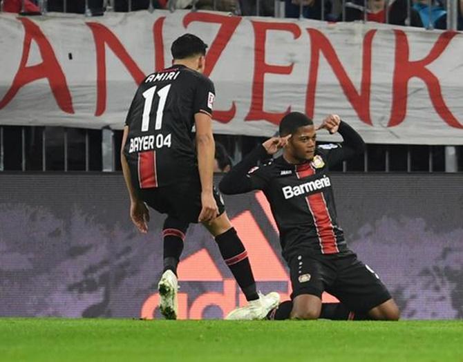 Leon Bailey celebrates scoring Bayer Leverkusen's first goal against Bayern Munich