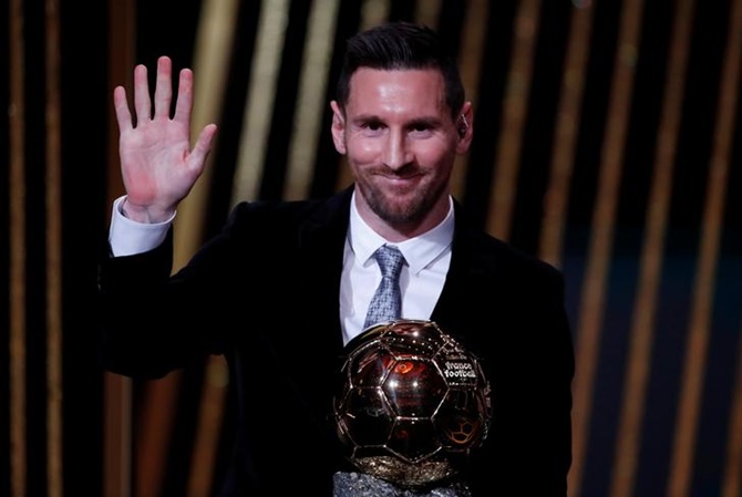 Barcelona's Lionel Messi waves to the crowd after receiving the the Ballon d'Or award at the Theatre du Chatelet, in Paris. 