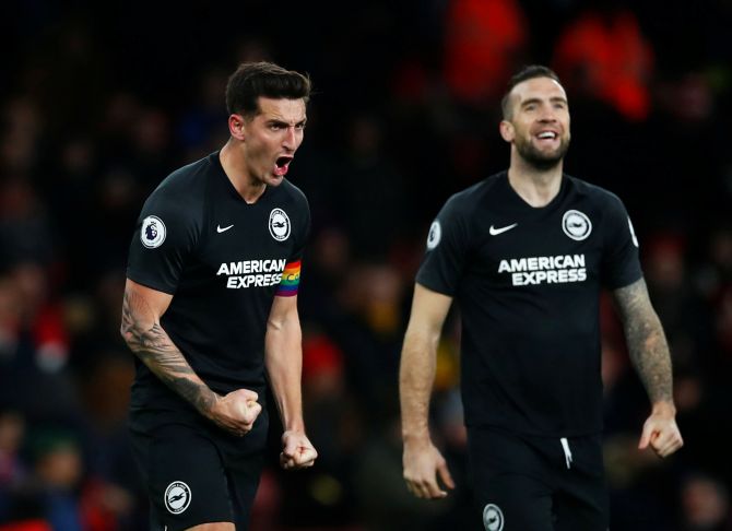 Brighton & Hove Albion's Lewis Dunk and Shane Duffy celebrate after the match