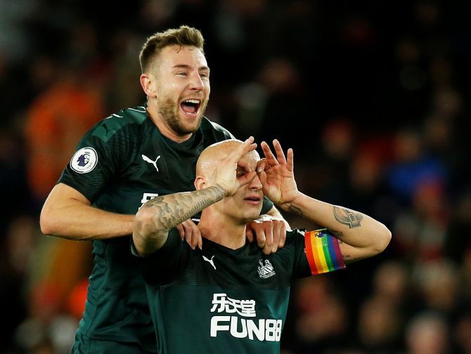 Newcastle United's Jonjo Shelvey celebrates scoring their second goal with teammate Paul Dummett during their match against Sheffield United at Bramall Lane, Sheffield