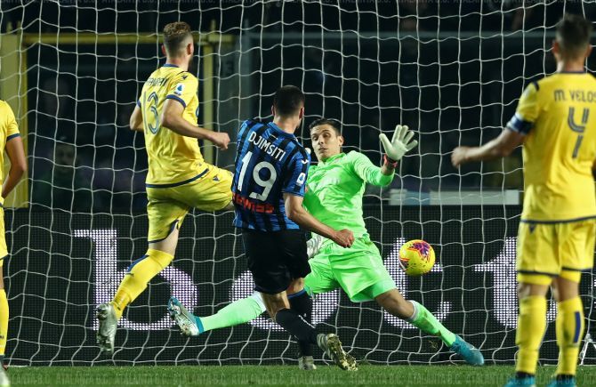 Atalanta's Berat Djimsiti scores past Verona's keeper Marco Silvestri to score the last minute winner in their Serie A match at Gewiss Stadium in Bergamo, Italy on Saturday