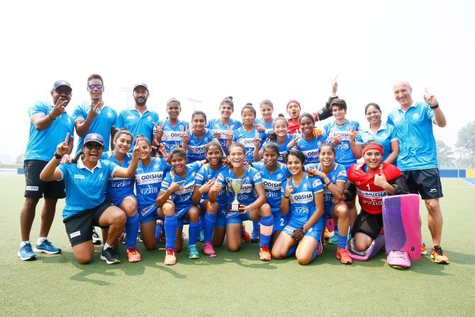 The Indian junior women's hockey team and support staff celebrate on winning the 3-nation tournament in Canberra, Australia, on Sunday