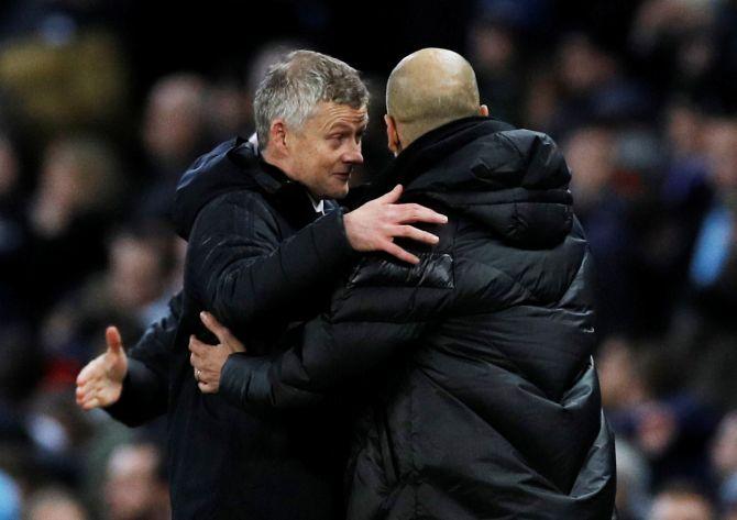 Manchester City manager Pep Guardiola and Manchester United manager Ole Gunnar Solskjaer after the Manchester derby last month