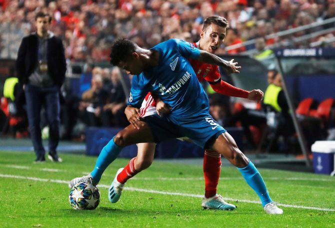 Zenit Saint Petersburg's Wilmar Barrios in action and Benfica's Chiquinho battle for the ball during their Champions League Group G match at Estadio da Luz in Lisbon, Portugal