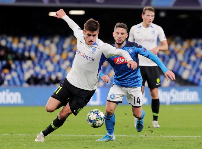 Napoli's Dries Mertens and KRC Genk's Joakim Maehle battle for possession during their Champions League Group E match at Stadio San Paolo in Naples, Italy