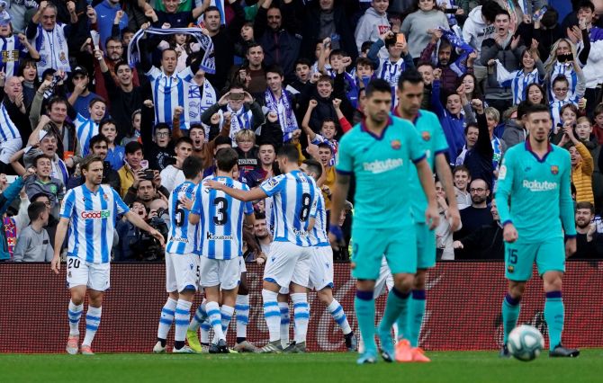 Real Sociedad's Mikel Oyarzabal celebrates  with teammates after scoring their opening goal