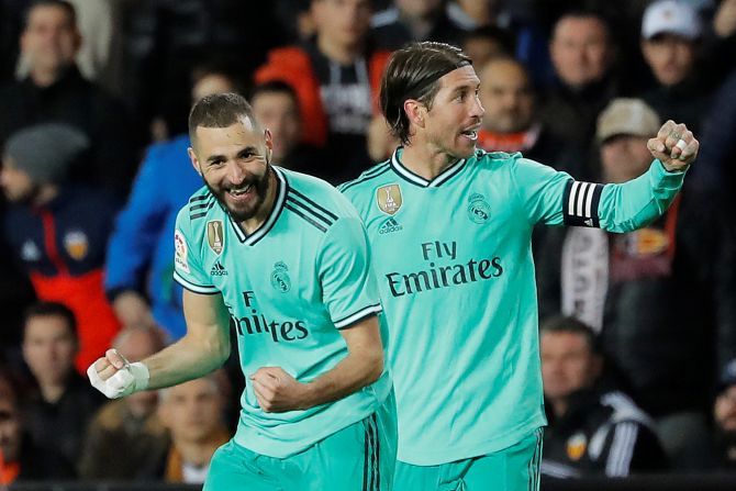 Real Madrid's Karim Benzema celebrates with Sergio Ramos on netting the equaliser