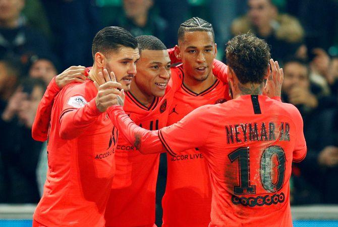 Paris St Germain's Kylian Mbappe celebrates scoring their fourth goal with Neymar and teammates after scoring against AS Saint-Etienne during their Ligue 1 match at Stade Geoffroy-Guichard, Saint-Etienne 